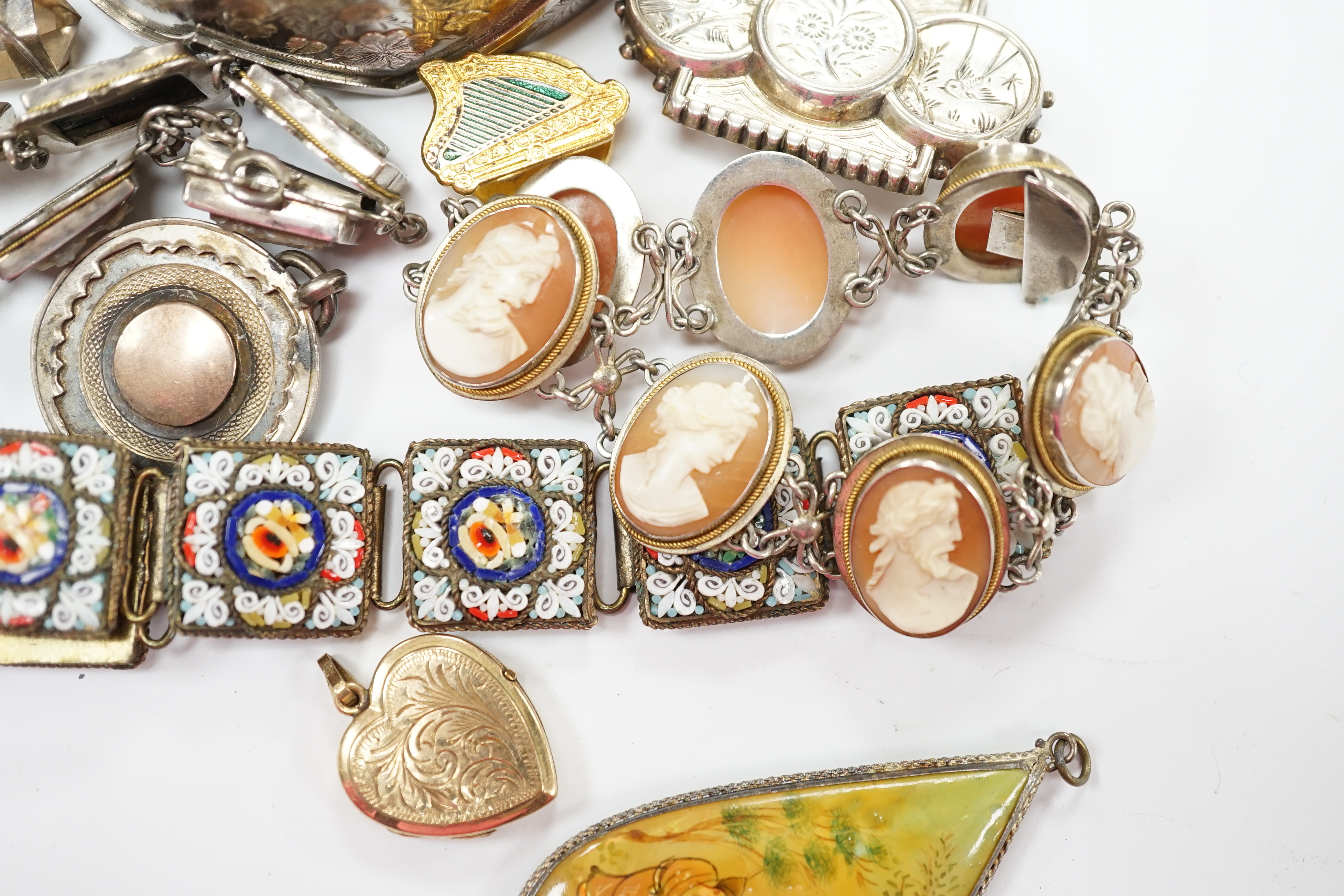 Assorted Victorian and later jewellery including a late Victorian three colour yellow metal and silver bangle, a white metal brooch with aesthetic engraved decoration, cameo mother of pearl and shell bracelets, micro mos